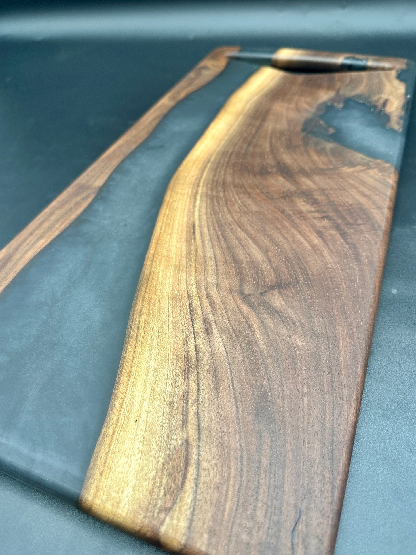 Walnut board with charcoal gray resin
