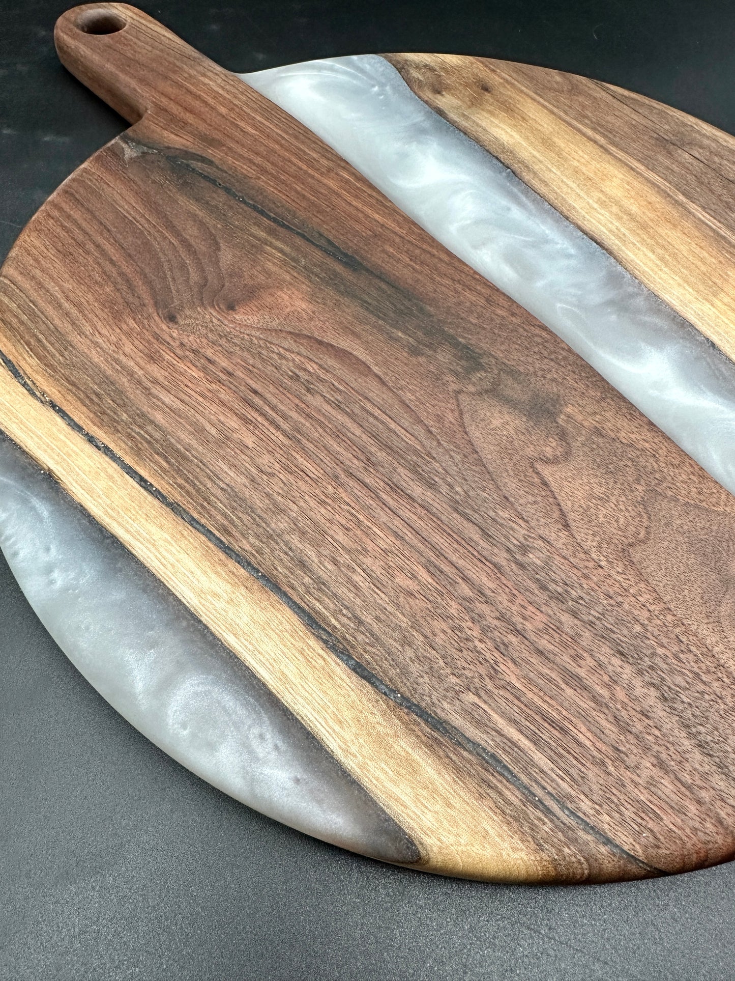 Small round walnut board with pearl white resin