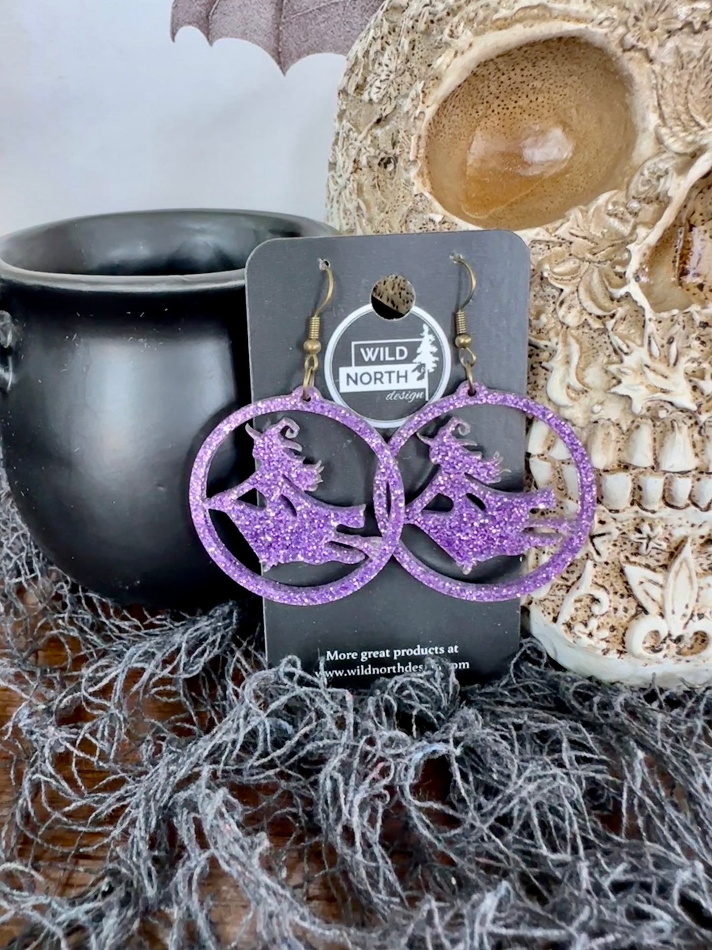 Witch on a broom Halloween earrings