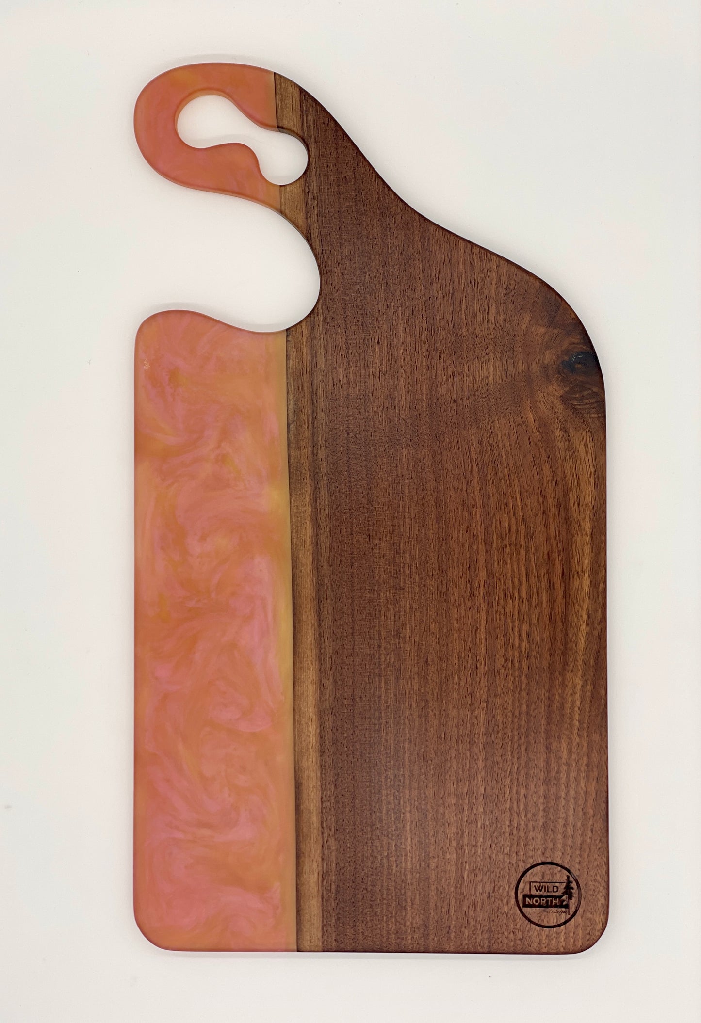 Walnut board with translucent pink resin
