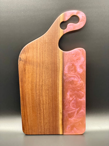 Walnut board with translucent pink resin