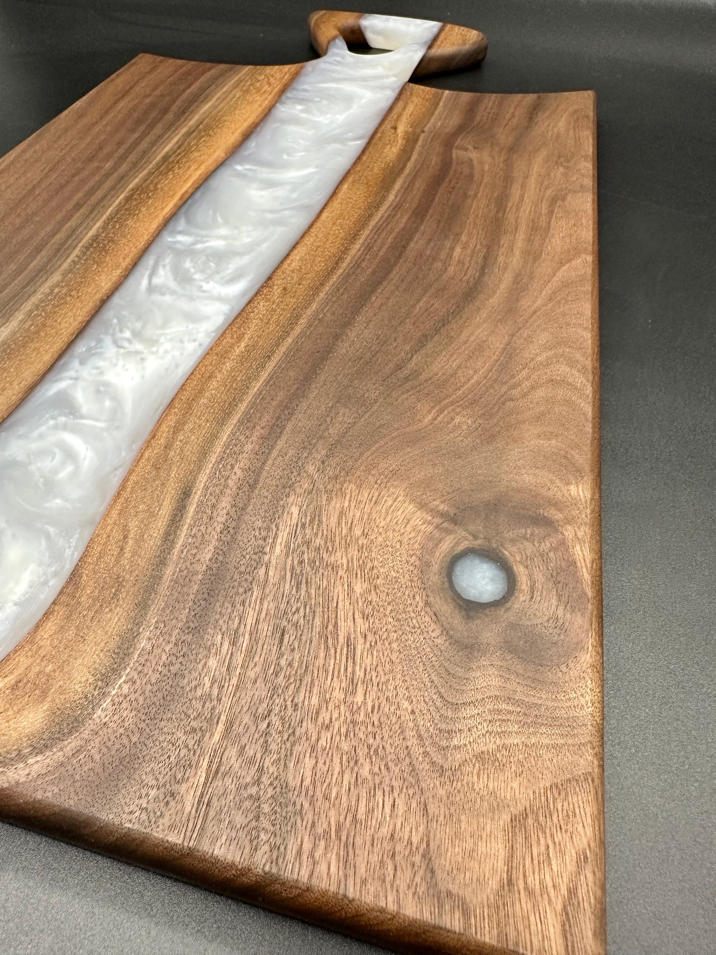 Walnut board with pearl white resin