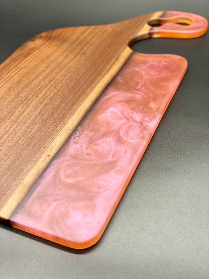 Walnut board with translucent pink resin