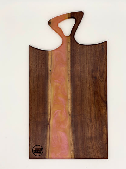 Walnut board with translucent pink resin